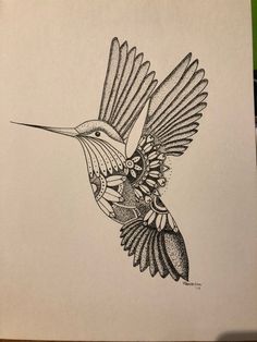 a black and white drawing of a hummingbird flying in the air with its wings spread out