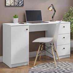 a white desk with a laptop on top of it and a chair in front of it