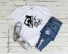 a t - shirt with the word eagles on it next to ripped jeans and sneakers