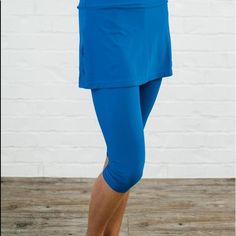 Brand New Never Worn Still In Package. Royal Blue 82% Nylon 18% Spandex - Upf 50+ Sun Protection - High Waisted: Wide Waistband Sits Just Below Your Natural Waist For Slenderizing Tummy Control - Capri Length Leggings Hit Below The Knee - Attached Skirt Hits Mid High Thigh, Specially Designed For Coverage. - Inseam Length 17.4” (Size S) - Skirt Length 12.2” (Size S) Blue Activewear With Built-in Shorts, Versatile Blue Workout Bottoms, Versatile Blue Bottoms For Workout, Stretch Blue Swim Skirt With Elastic Waistband, Blue Stretch Swim Skirt With Elastic Waistband, Sporty Stretch Blue Swim Skirt, Blue Compression Versatile Bottoms, Blue 4-way Stretch Bottoms For Spring, Versatile Summer Compression Bottoms