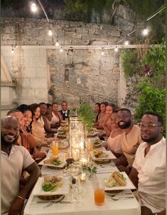 a group of people sitting around a dinner table