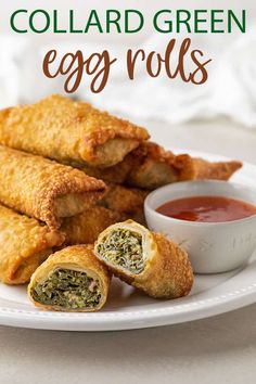 egg rolls on a plate with dipping sauce