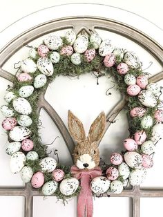 an easter wreath with eggs and a bunny head