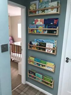 the bookshelves are lined up against the wall