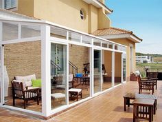 an outside patio with tables and chairs