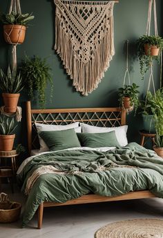 a bed with green sheets and pillows in a room filled with potted plants on the wall