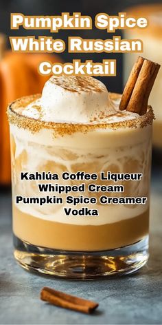 pumpkin spice white russian cocktail with whipped cream and cinnamon stick in the glass on top