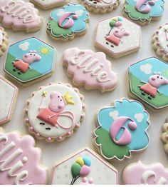 decorated cookies are arranged in the shape of hefty animals and letters on them