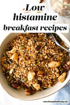 a bowl filled with granola and nuts on top of a table