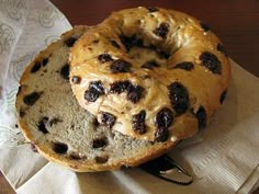 a chocolate chip donut sitting on top of a napkin