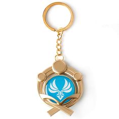 a blue and gold keychain with an emblem on it's center piece