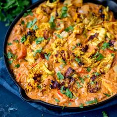 a skillet filled with food and garnished with cilantro