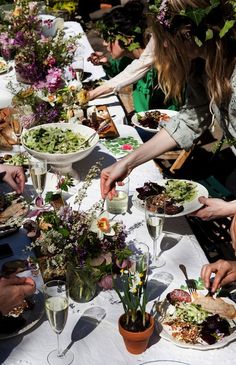 a group of people sitting around a table eating food