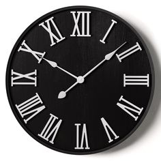 a black and white clock with roman numerals