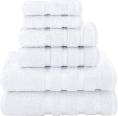 six white towels stacked on top of each other