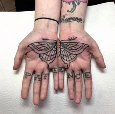 two hands that have tattoos on them with the words paternics written on them