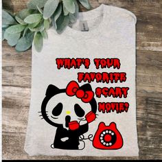 a t - shirt with an image of a hello kitty drinking coffee