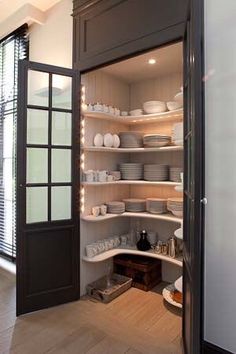 an open pantry filled with lots of dishes