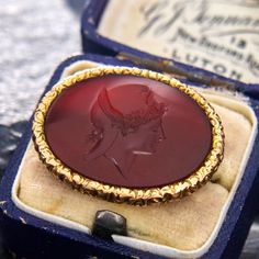 This lovely pin is crafted of 14k yellow gold and features an oval carnelian intaglio. The piece was tested and stamped "FRAME: 14K". The pin on the back is not gold. Antique Engagement Rings Sapphire, Stamp Frame, Estate Jewelry Rings, Wedding Ring Diamond Band, Brand Presentation, Cameo Brooch, Antique Engagement Rings, Tiffany And Co, European Cut Diamonds