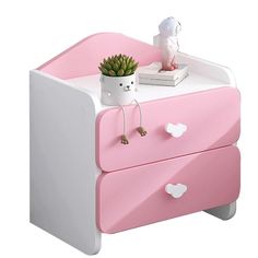 a pink and white dresser with a potted plant on top