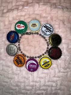 a bunch of bottle caps that are on a chain