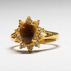 Beautiful and Impressive Tigers Eye Yellow Gold 18KT HGE Size 5 Fashion Ring with Sparkling Diamonds Cut Crystals. Great condition Hallmarked DC - Dolphin Ore Collection This is an 18Kt HGE (Heavy Gold Electroplated) ring. Garnet Drop Earrings, Costume Rings, Crystals Jewelry, Sparkling Rings, Luxury Rings, Garnet Earrings, Birthday Jewelry Gift, Fashion Ring, Tigers Eye