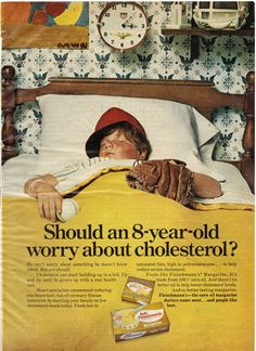 an old advertisement for cholesetol with a boy in bed wearing a baseball cap and mitt