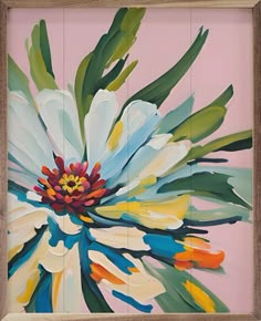 an abstract painting with multicolored flowers in a wooden frame