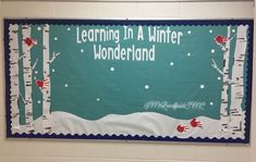 a bulletin board with the words learning in a winter wonderland written on it and trees