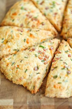 a cheesy scones cut into eight pieces on a cutting board