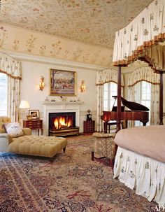 a bedroom with a bed, couch and piano in it's centerpieces