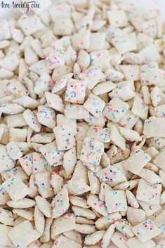 white dog treats with sprinkles on them are ready to be cut and put in the freezer