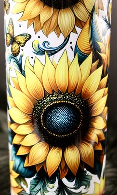 an artistically painted vase with sunflowers and butterflies