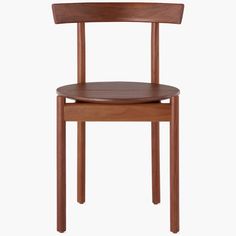 An eye-catching addition to your dining area, the Comma Chair (2021) embodies the warmth and craft evident in the best 20th-century designs. Taking cues from minimalist Scandinavian and Japanese aesthetics, this geometric design features a circle seat, steam-bent backrest, and straight legs. “For me, it was very important that the chair had generosity in its spirit, even though it was reduced to a few elements,” says designer Michael Anastassiades. | Comma Dining Side Chair, Walnut at Design Wit Michael Anastassiades, Chair Height, Chair Bench, Herman Miller, Kitchen & Dining Chairs, Furniture Dining Chairs, Design Within Reach, Side Chairs Dining, A Circle