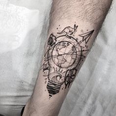 a man's arm with a clock and compass tattoo on the left side of his leg