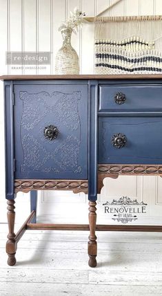 an old dresser painted in blue and white with wood handles, turned into a sideboard