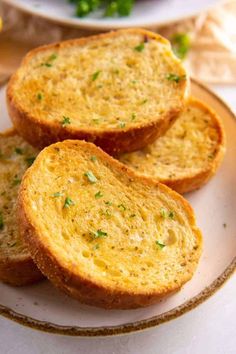 three slices of garlic bread on a plate