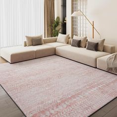 a living room with a large rug on the floor