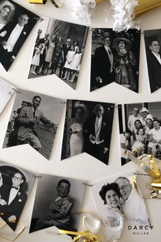 black and white photo hanging on the wall next to some gold ribbon with confetti