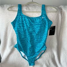 Nwt $88 Nike U-Back One-Piece Swimsuit Blue & White. Womens Size Medium. Fitted And Flattering Style. Removable Pads. Brand New. Never Been Worn. Embroidered Swoosh Questions? Leave A Comment Below! Blue Fitted One-piece For Poolside, Fitted Blue One Piece For Poolside, Sports Blue One-piece Swimwear, Blue One-piece Swimwear For Sports, Casual Blue One-piece Swimsuit For Pool, Casual Blue One-piece For Pool, Blue Fitted Casual One-piece, Casual Fitted Blue One-piece, Fitted Casual Blue One Pieces