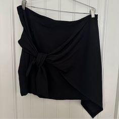 Black Super Cute Skirt With Asymmetric Style. Has Back Zipper! The Sarong Style Drapes Over To Side! Black Asymmetrical Hem Draped Skirt For Work, Black Draped Skirt With Asymmetrical Hem For Work, Chic Black Draped Skirt With Asymmetrical Hem, Black Asymmetrical Draped Skirt, Black Asymmetrical Draped Skirt For Night Out, Black Draped Skirt With Asymmetrical Hem For Party, Chic Black Asymmetrical Draped Skirt, Chic Black Draped Skirt For Workwear, Black Asymmetrical Relaxed Fit Draped Skirt