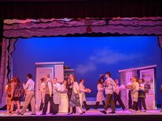 a group of people standing on top of a stage