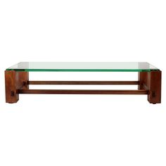 a glass and wood coffee table on white background