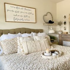 a bedroom with a bed, dresser and pictures on the wall above it that says you are still there