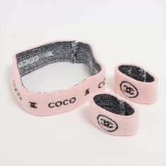 The Chanel Coco Cc Logo Knit Headband & Wristband Set In Pink And Black Is A Chic And Stylish Accessory Duo That Effortlessly Combines Fashion With Function. Crafted From A Soft And Comfortable Knit Material, The Set Features A Pastel Pink Base Accented With The Iconic Black Cc Logo, Adding A Touch Of Luxury To Any Casual Ensemble. The Headband Provides A Snug And Cozy Fit, Perfect For Keeping Hair In Place And Adding A Fashionable Statement To Your Look. The Matching Wristbands Complement The H Headband Making, Knit Headband, Logo Knit, Wristband Bracelet, Elegant Logo, Cozy Fits, Cc Logo, Wristbands, Sports Activities