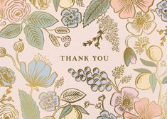 a thank card with colorful flowers and leaves on the front, in gold lettering that says thank you