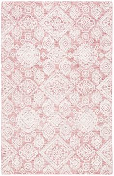 a pink and white rug with an intricate design