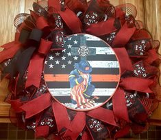 a wreath with an image of a baseball player and the american flag is on it