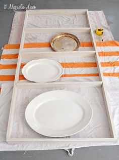 the table is set up with plates and utensils on it, ready to be used