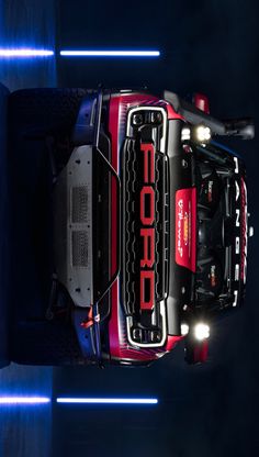 the top view of a red truck with its lights on